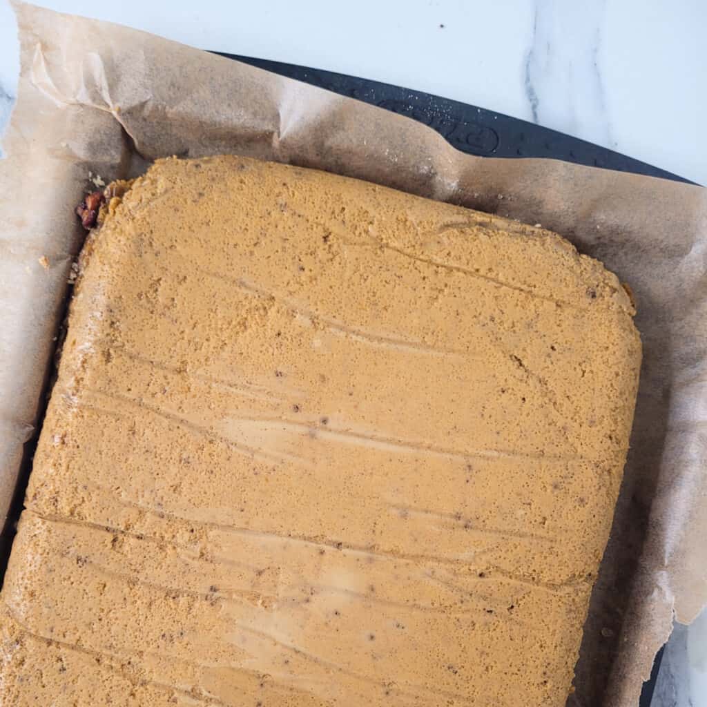 Upside down baked pumpkin crunch cake on a baking sheet