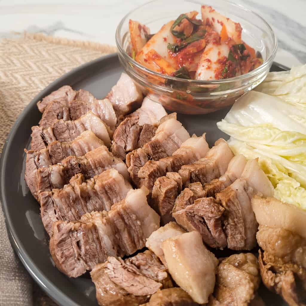 Close up of boiled pork on a gray plate