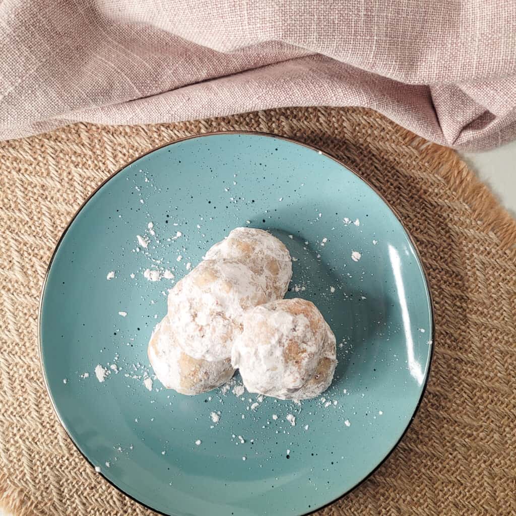 Almond tea cookies on a blue plate