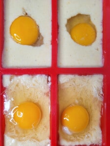 Cracked eggs over filled molds