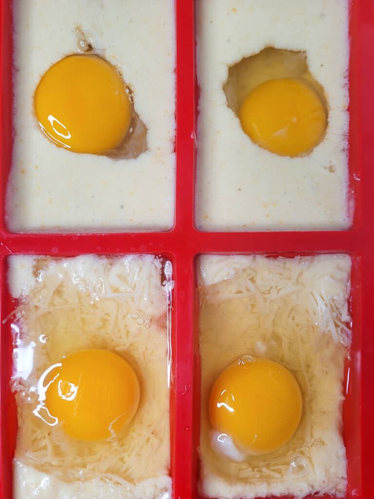 Cracked eggs over filled molds