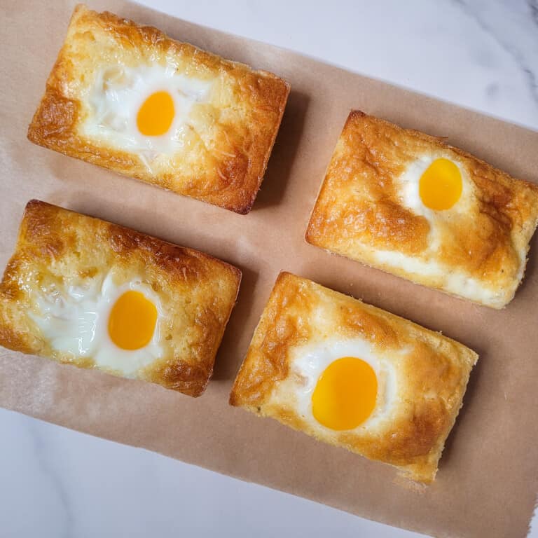 Overhead view of gyeran ppang or Korean egg bread on parchment paper