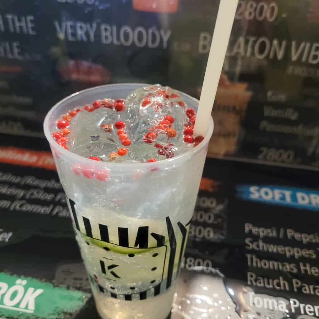 A cocktail name Local Hero with pink peppercorns