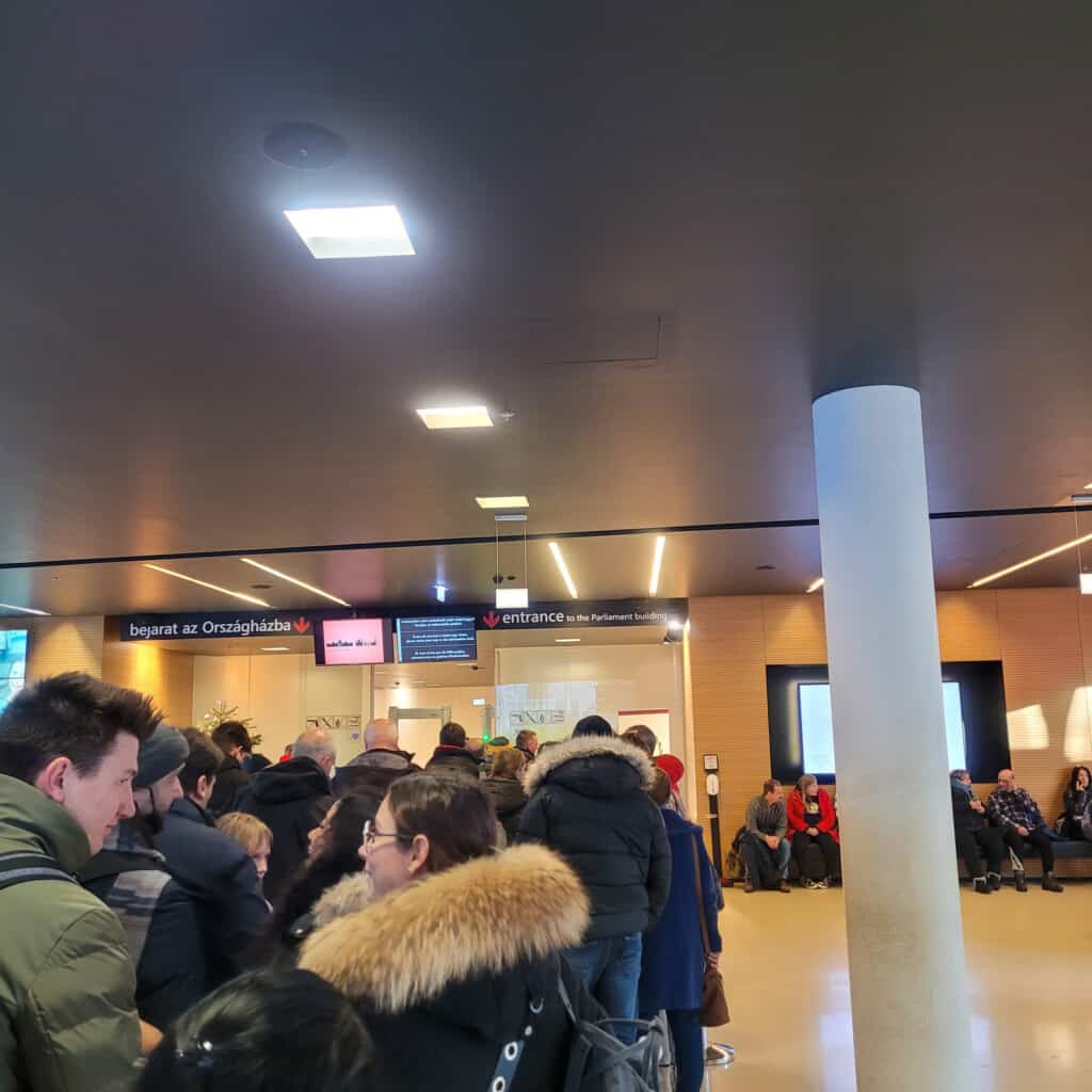 Tourists waiting in line inside the Hungarian parliament building