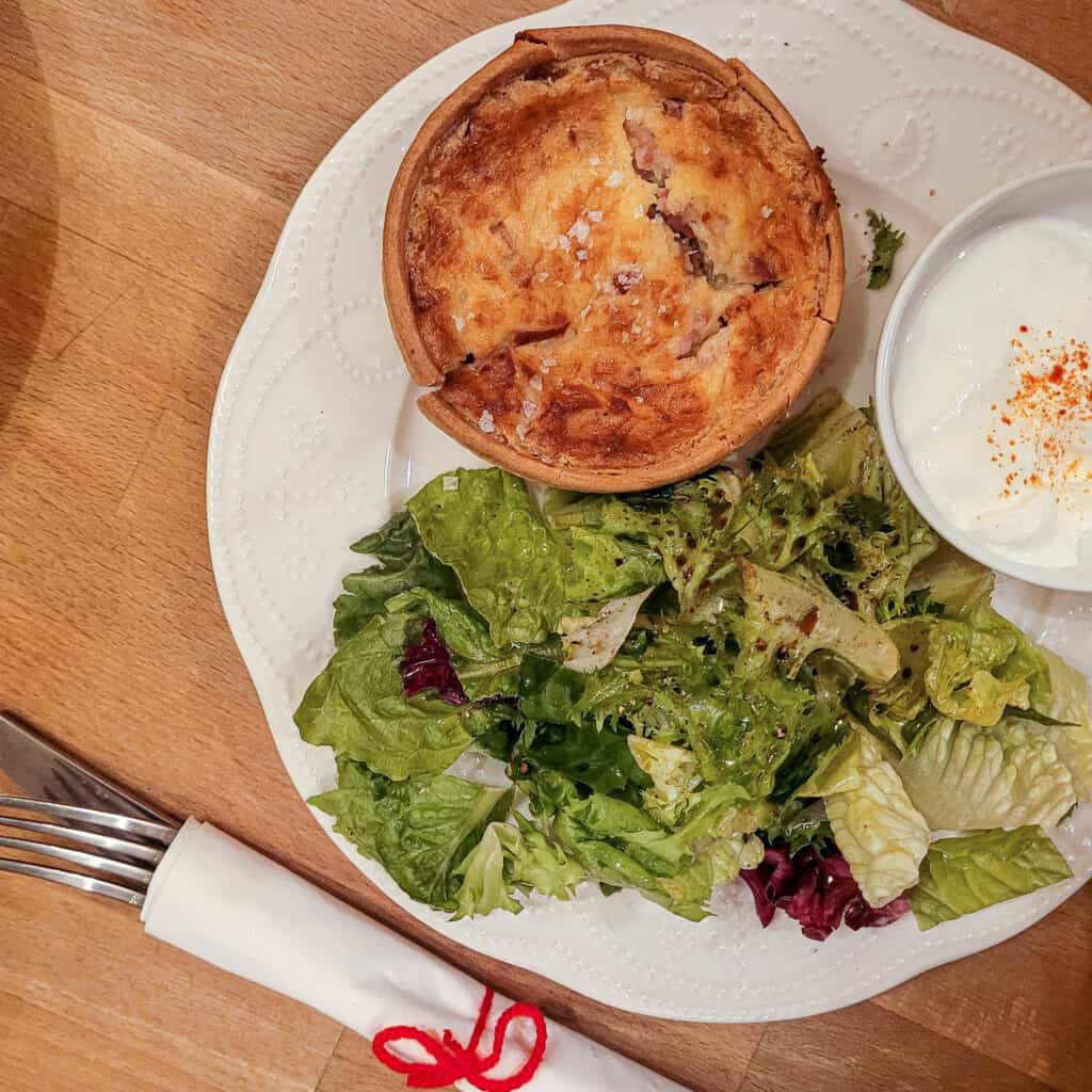 Quiche with salad on a plate