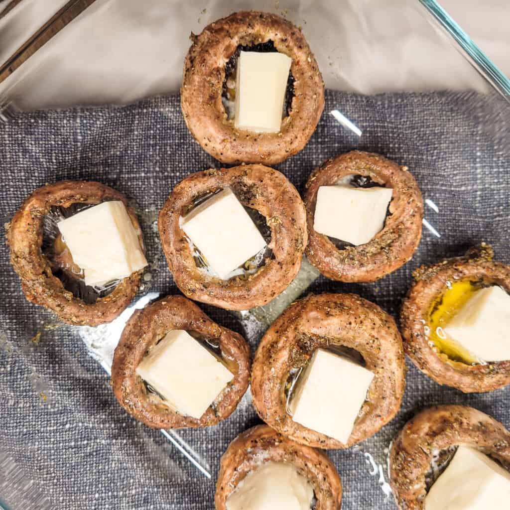 Cheese stuffed mushrooms or soko kecze in a baking pan