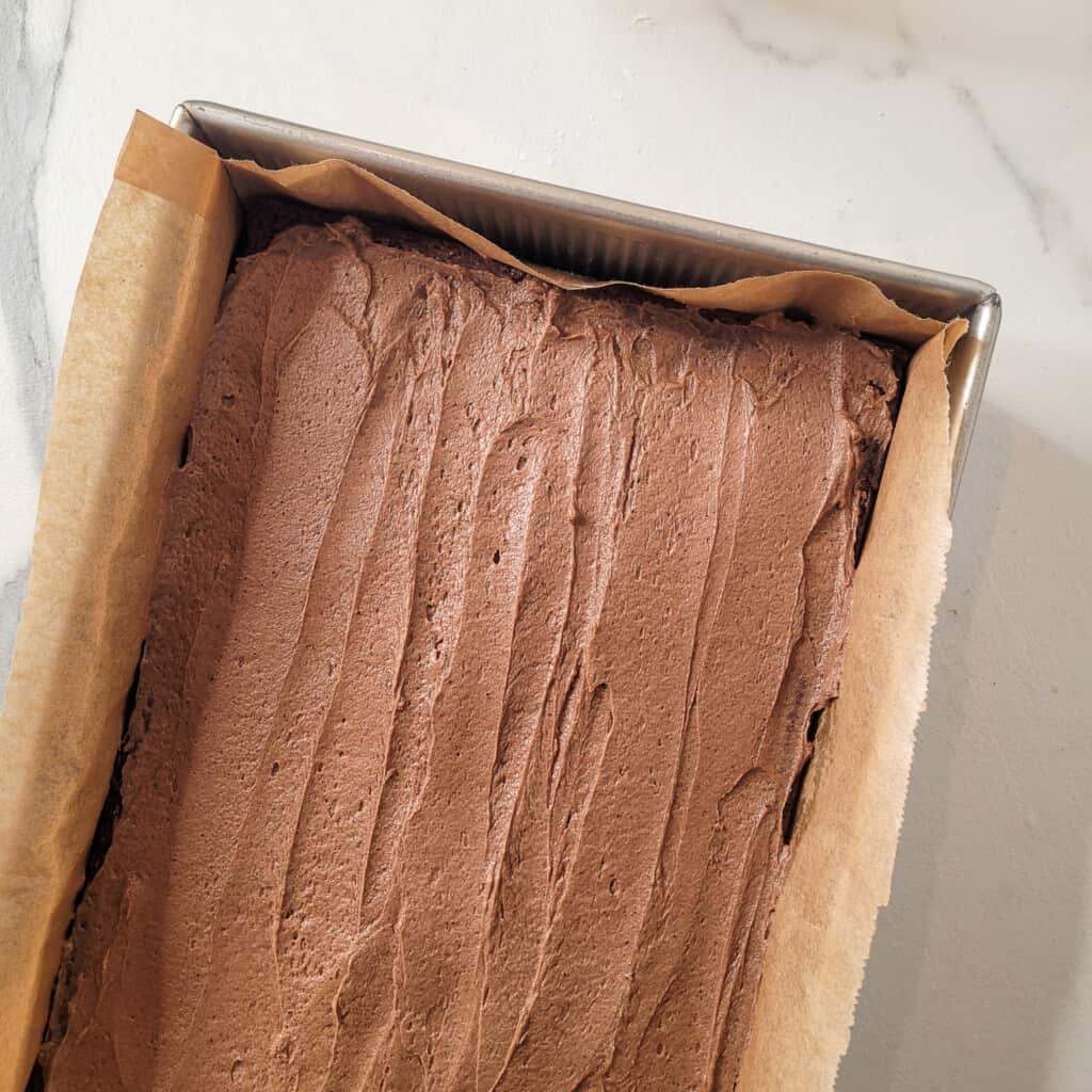 Frosted mocha brownie in a pan