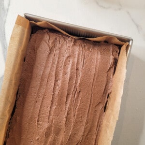 Frosted mocha brownie in a pan