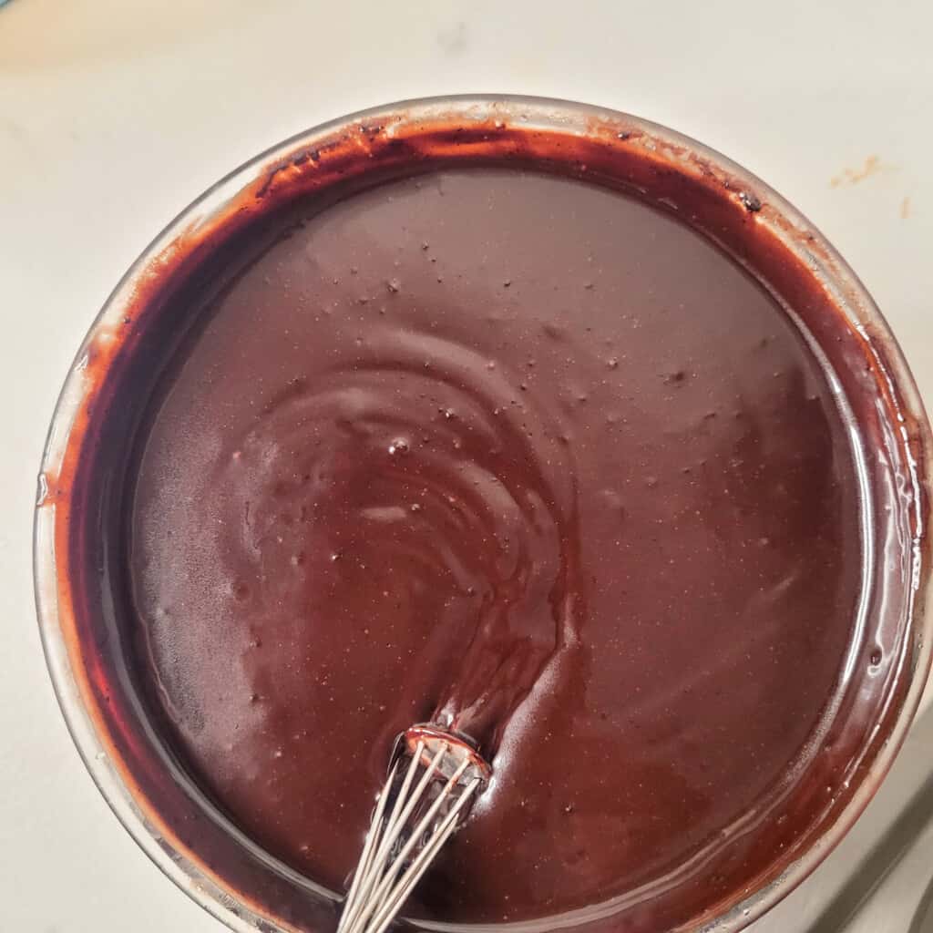 Melted chocolate in a glass bowl