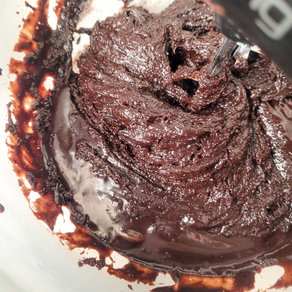 Combined dry and wet ingredients for mocha brownies in a bowl