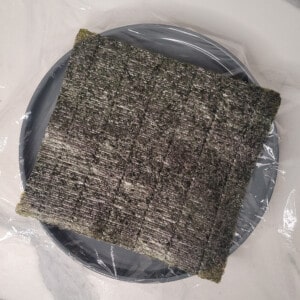 Seaweed sheet on top of a plate