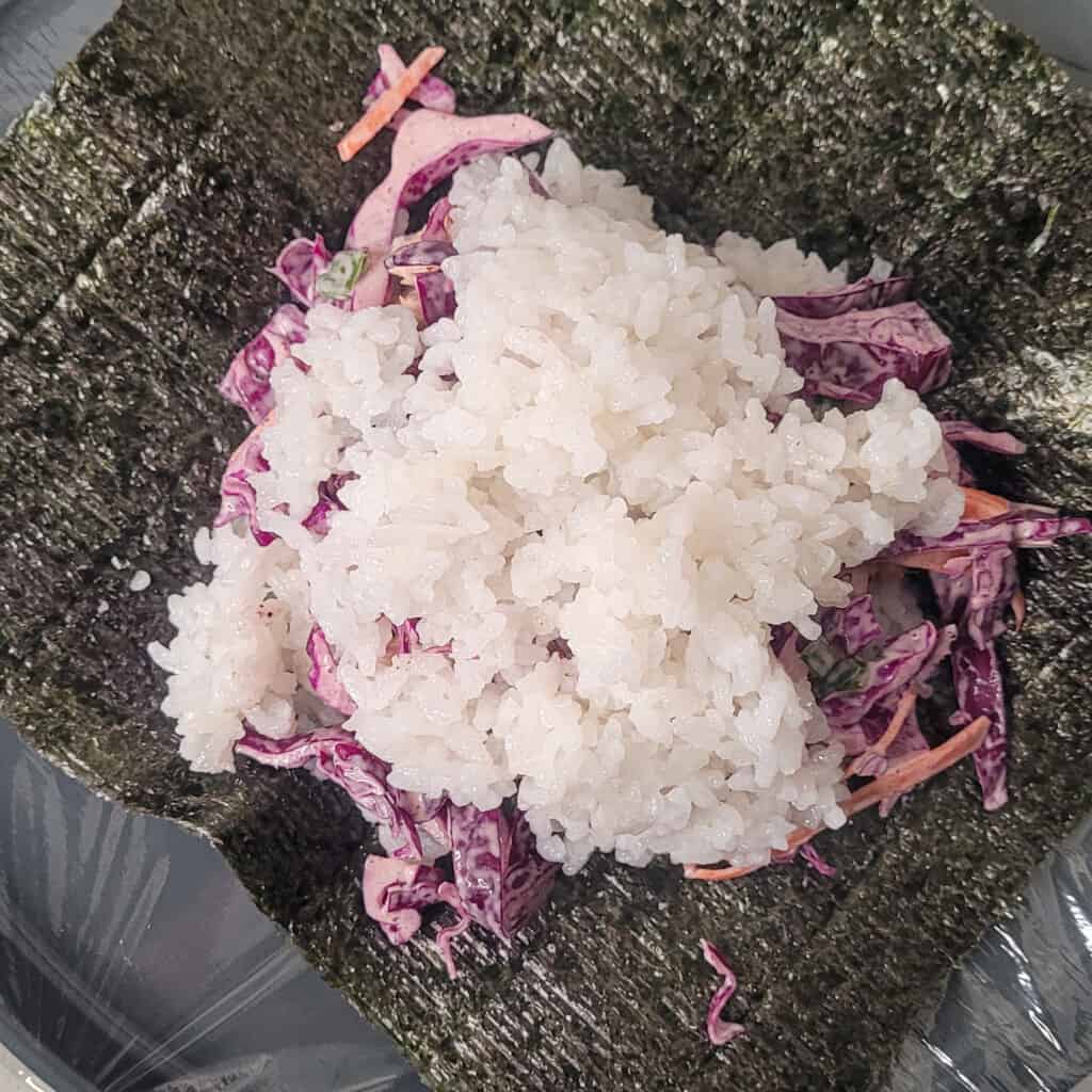 Rice and vegetables on a sheet of seaweed