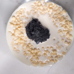 White Chocolate, heavy cream, and black sesame paste in a glass bowl
