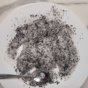 Black sesame powder and sugar spread on a plate