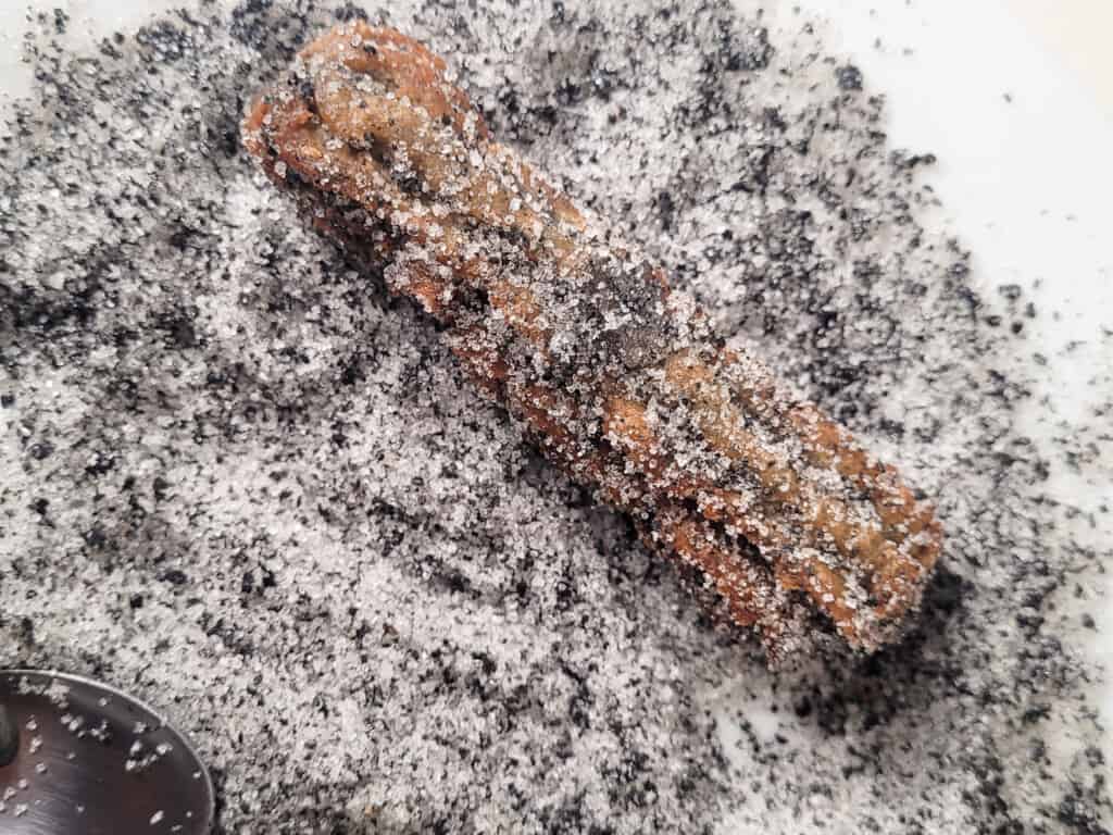 Churros rolled in black sesame sugar