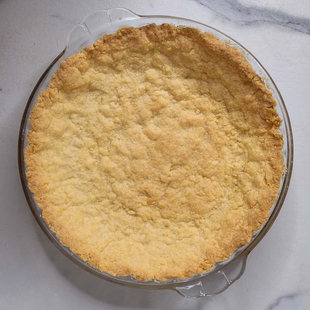 Strawberry custard pie crust after baking in the oven.