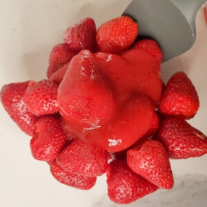 Strawberry glaze poured on top of strawberries.