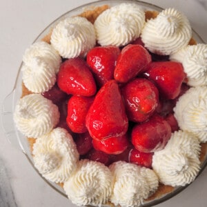 Strawberry custard pie on top of a countertop.
