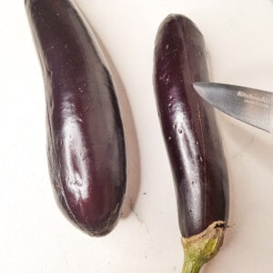 Scored line down an eggplant with a knife