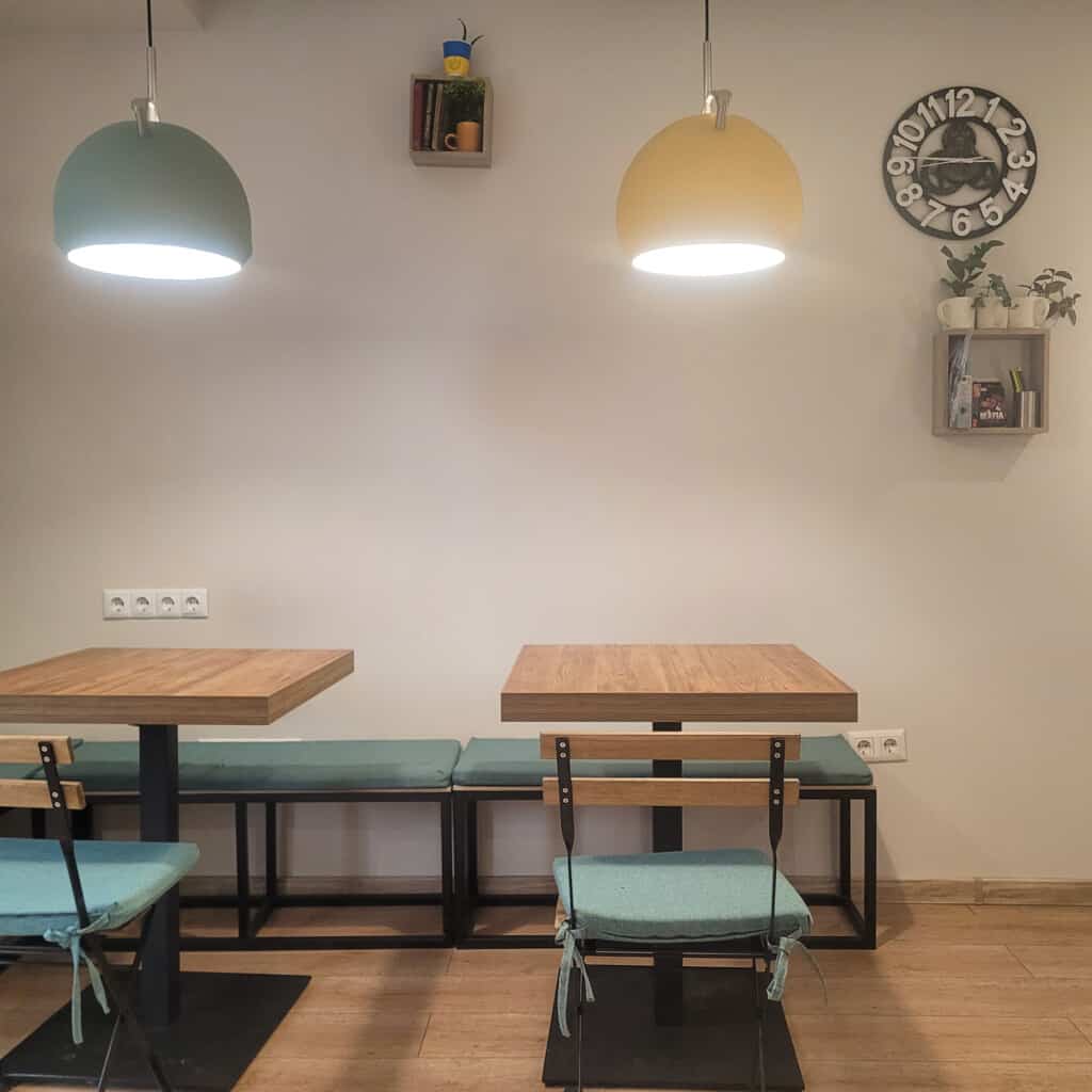 Chairs and tables with chargers inside Baho specialty coffee in Saburtalo, Tbilisi