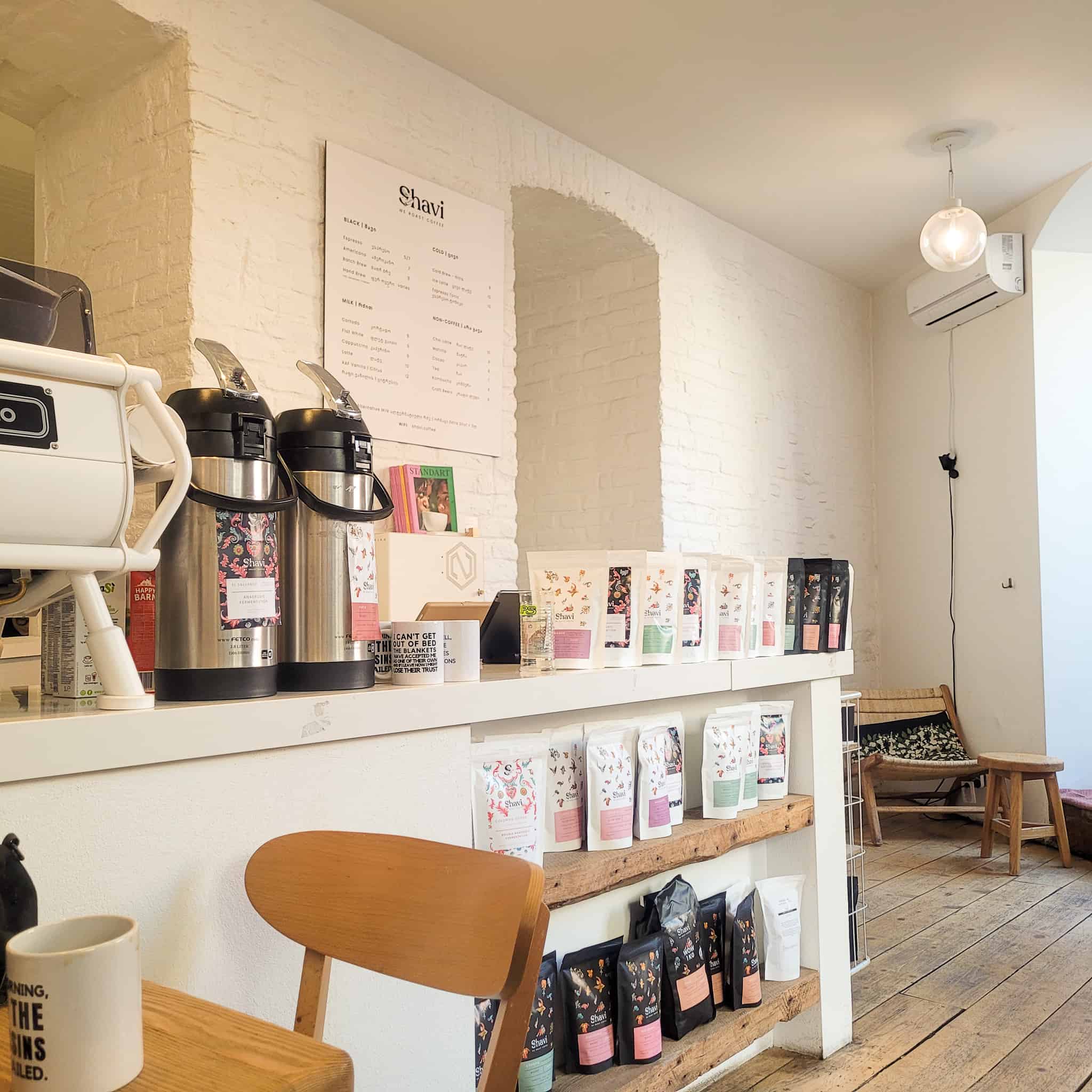The inside area of Shavi roasters, a counter with bagged beans in Tbilisi