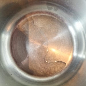Oil inside a silver pot
