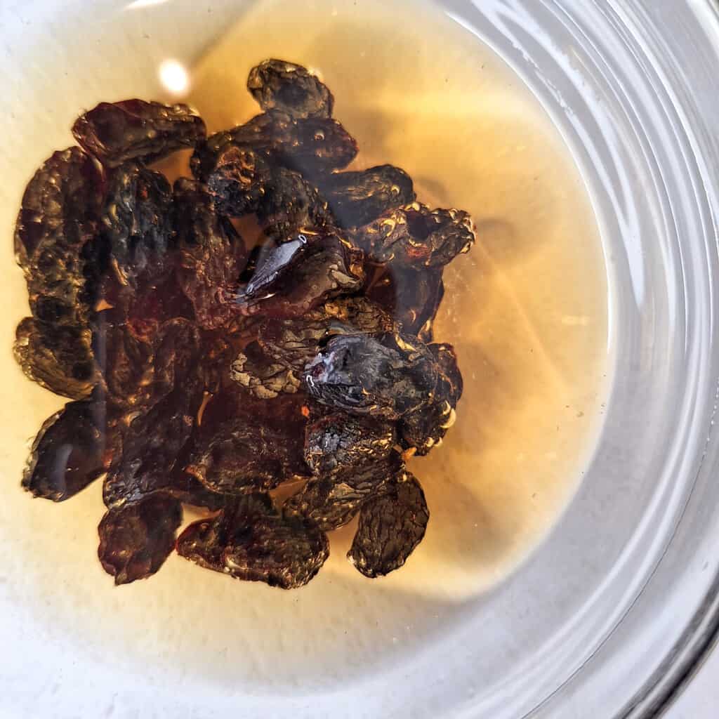 Small bowl with spiced rum and raisins