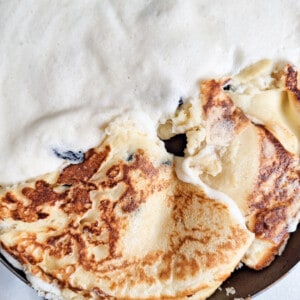Flip over Austrian Kaiserschmarrn or torn pancakes in sections