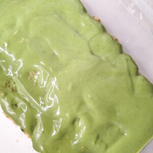 A custard layer of matcha custard on top of ladyfingers
