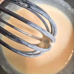 Cooked and thickened custard in a black pot