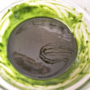 Melted butter and matcha powder in a glass bowl