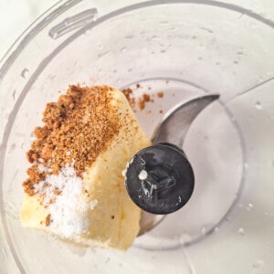 Butter, adjika, and salt in a food processor