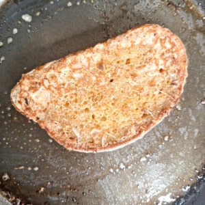 Fried Georgian egg bread or kikliko on a buttered pan