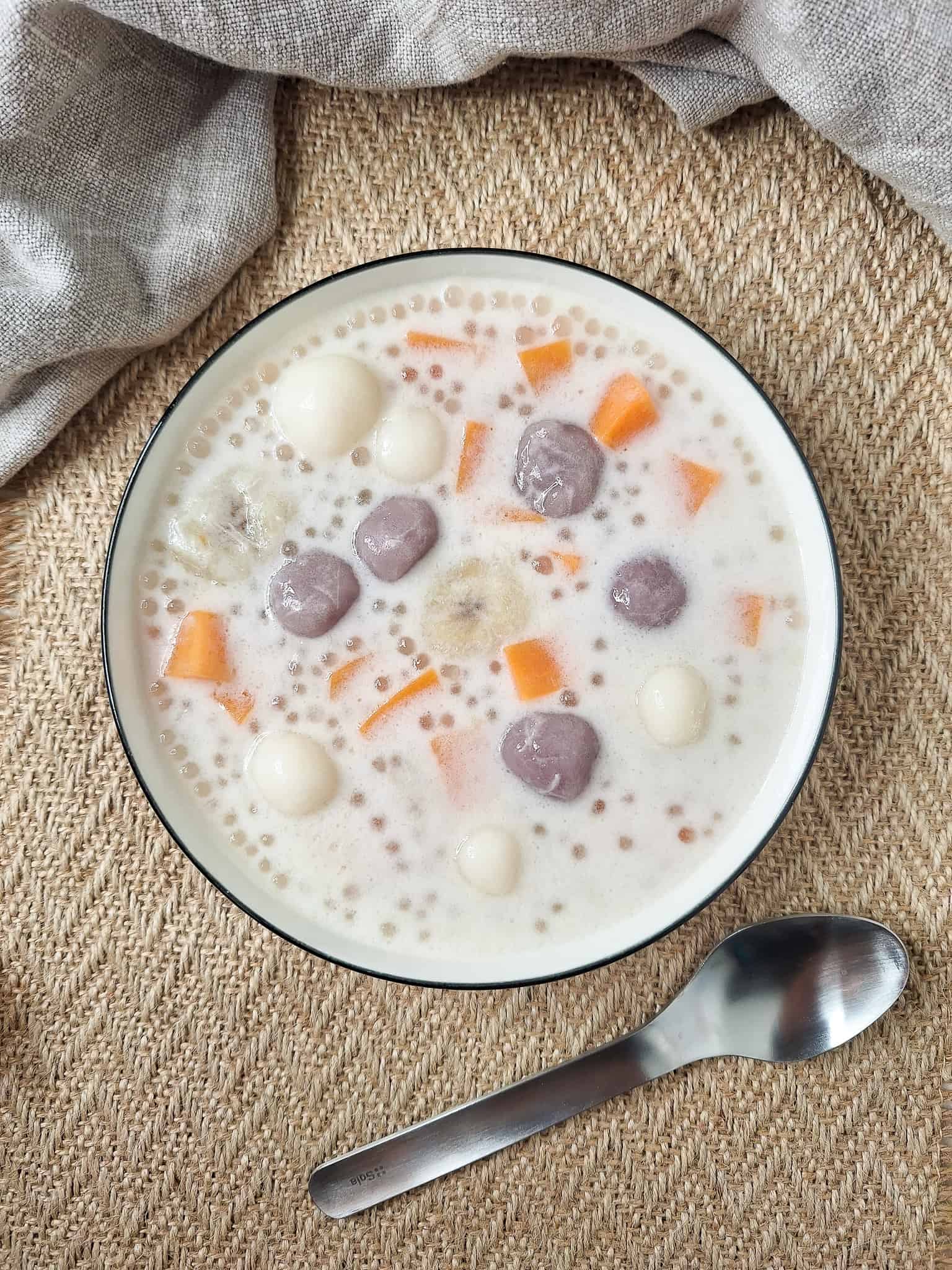 Filipino coconut dessert soup with sago or ginataang bilo bilo in white bowl