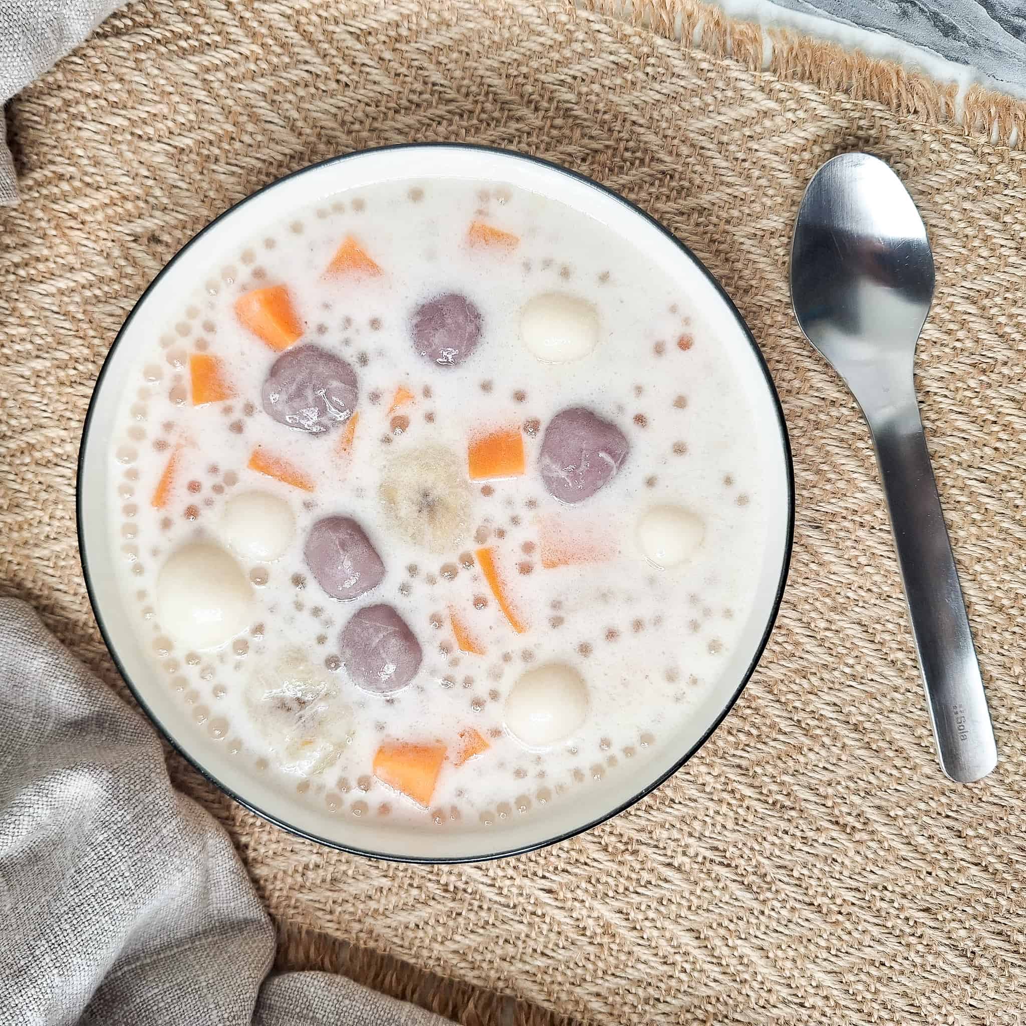 Filipino coconut dessert soup with sago or ginataang bilo bilo in white bowl