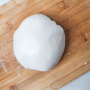 A ball of sweet rice flour on a wooden surface
