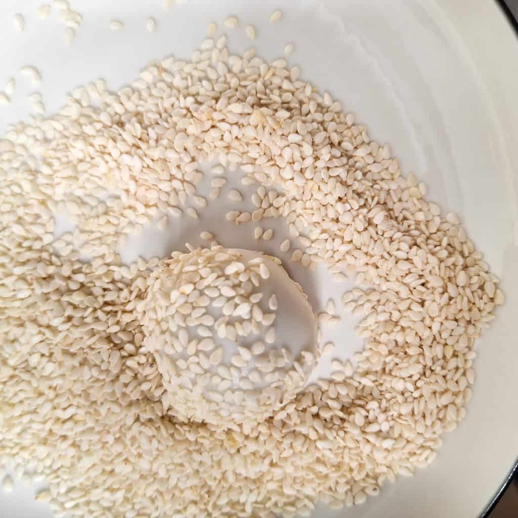 Ball of dough covered with sesame seeds