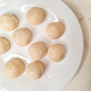 raw sesame balls filled with cinnamon caramel on a plate