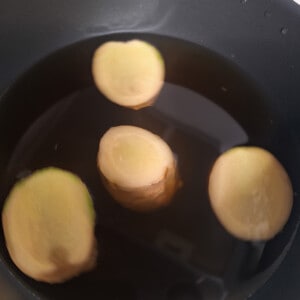 A pot filled with ginger tea