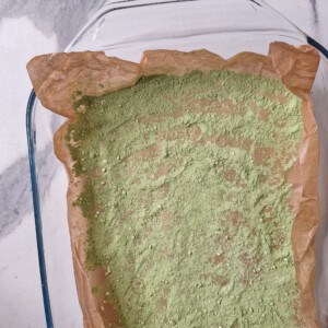 Dusted glass container with matcha powder