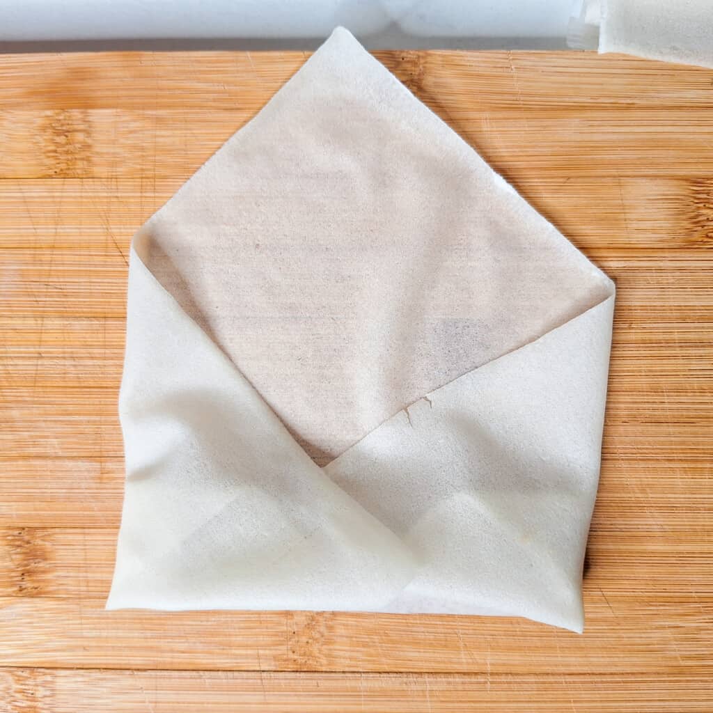Filipino spring roll or lumpia in process of rolling