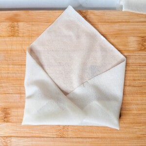 Filipino spring roll or lumpia in process of rolling