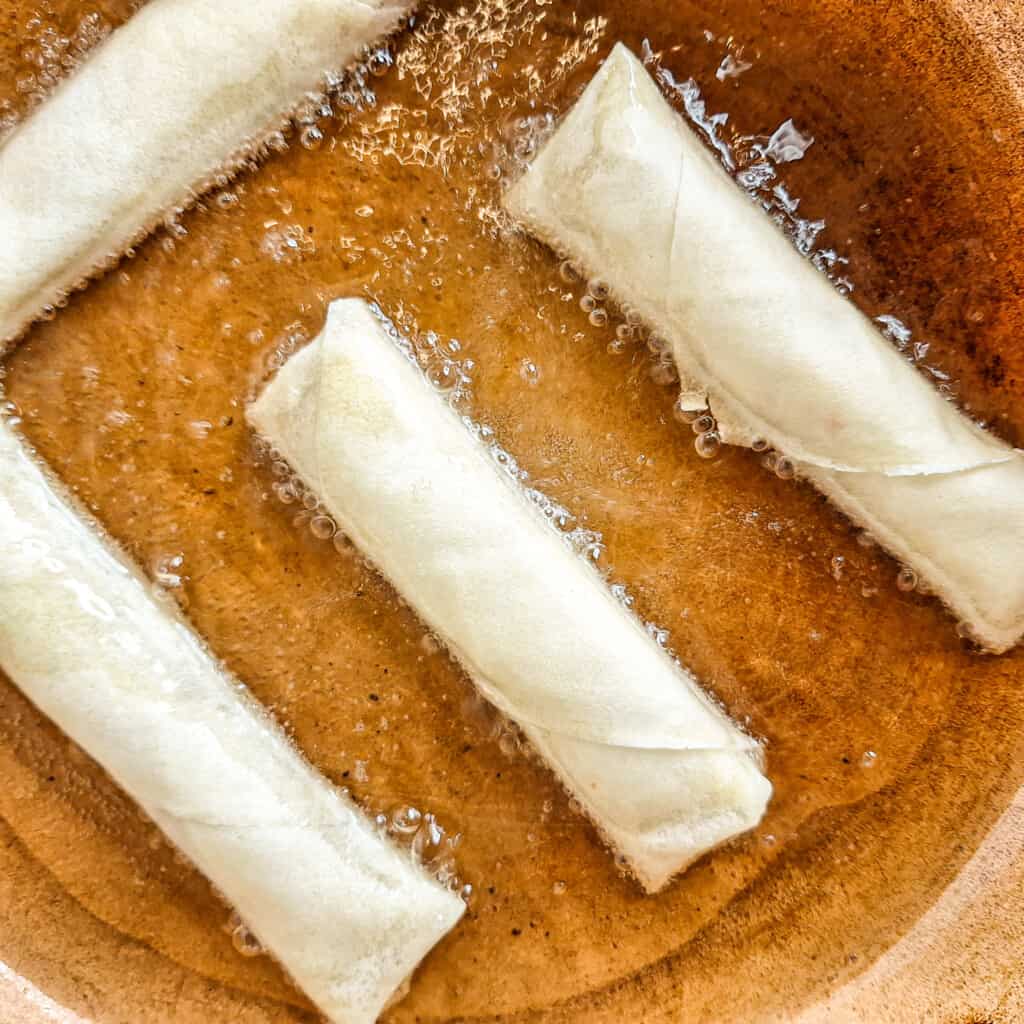 Frying lumpia shanghai on pan