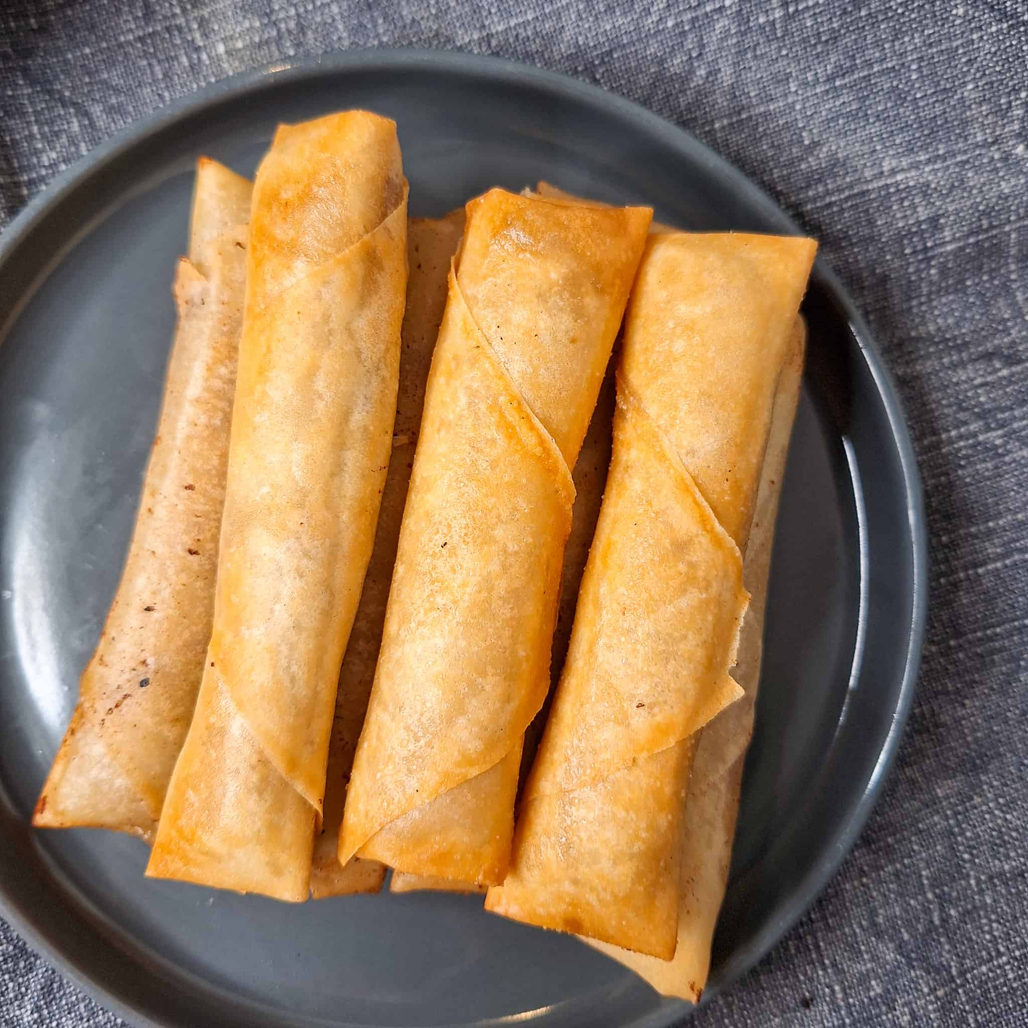 Lumpia shanghai stacked on a plate