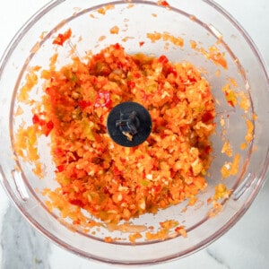 Minced carrots and other vegetables in a food processor