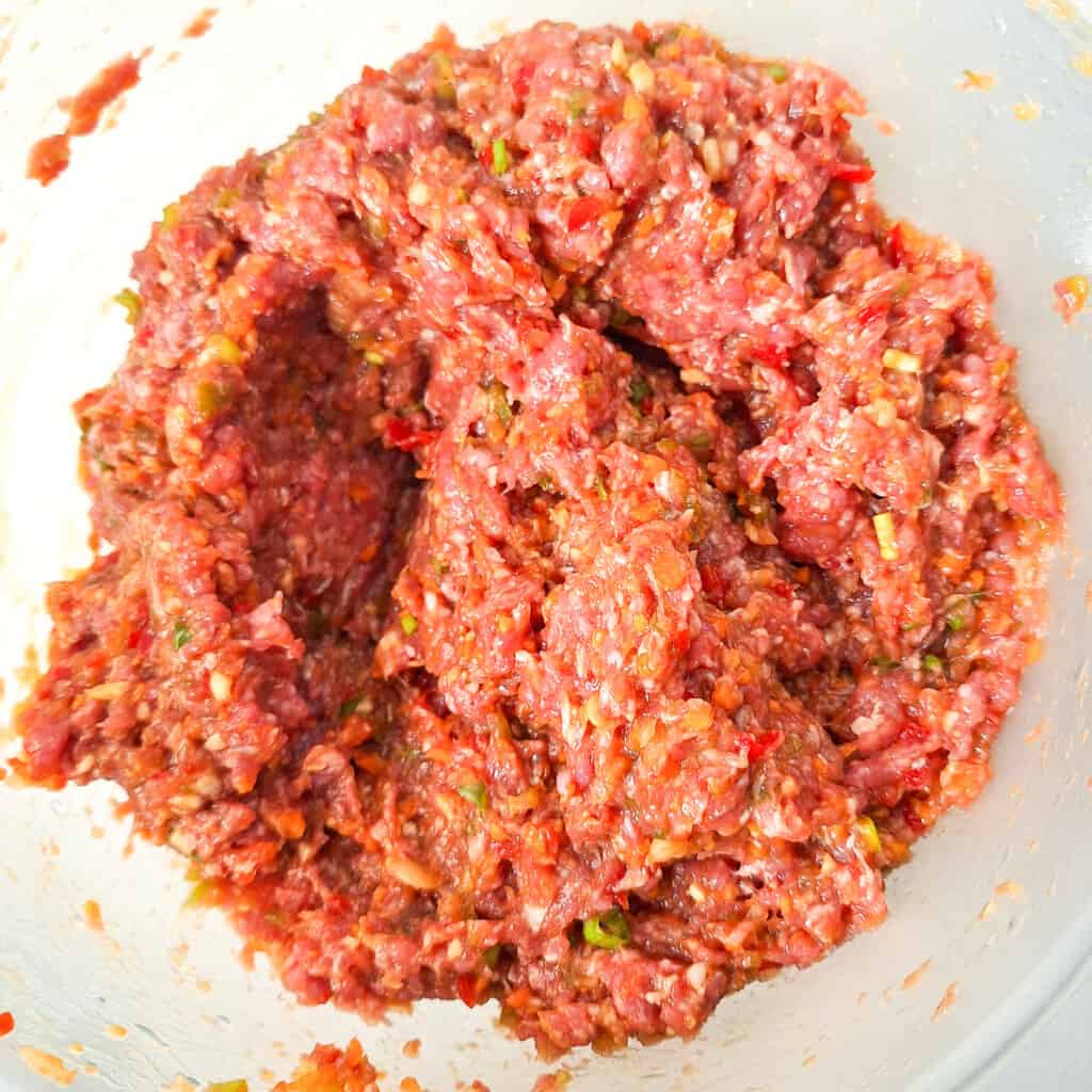 Mixed lumpia filling in a plastic bowl