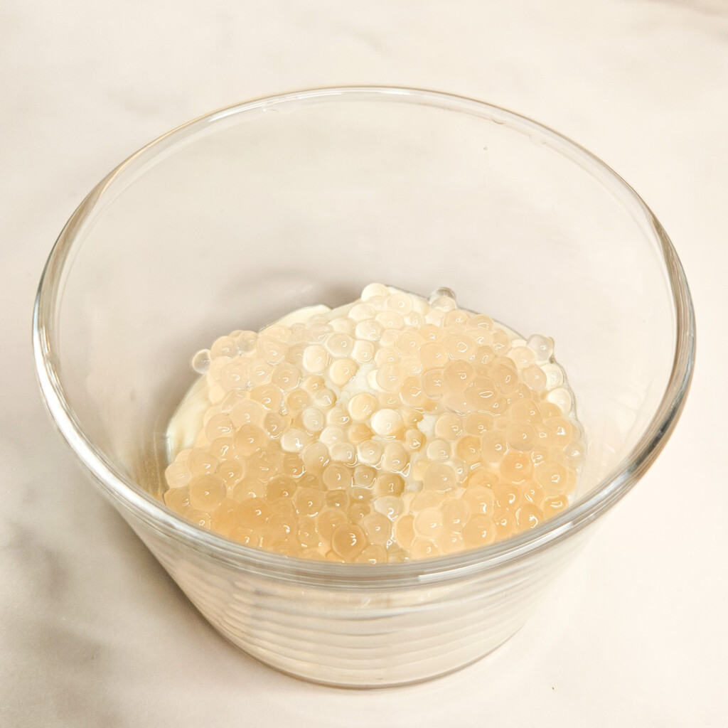 Tofu pudding and tapioca balls for a taho recipe in a glass bowl