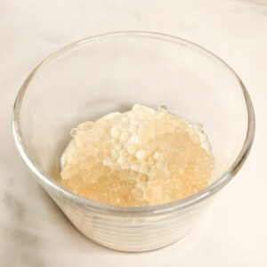 Tofu pudding and tapioca balls for a taho recipe in a glass bowl