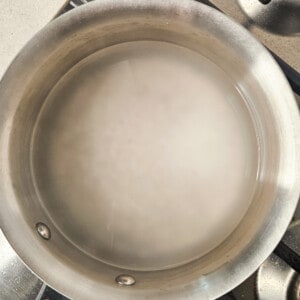 Let the tapiocal balls sit in the hot water in a stainless steel pot