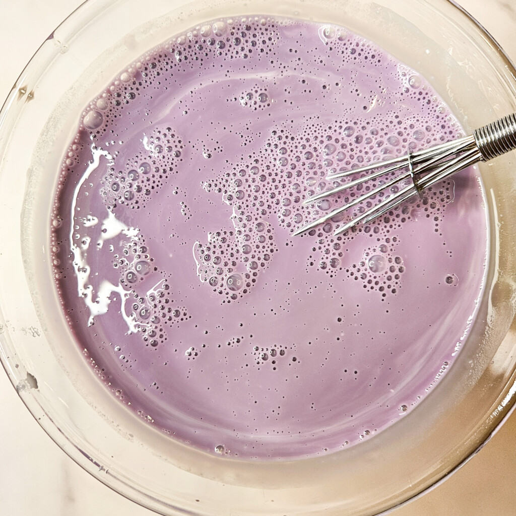 Glass bowl with ube milk mixture
